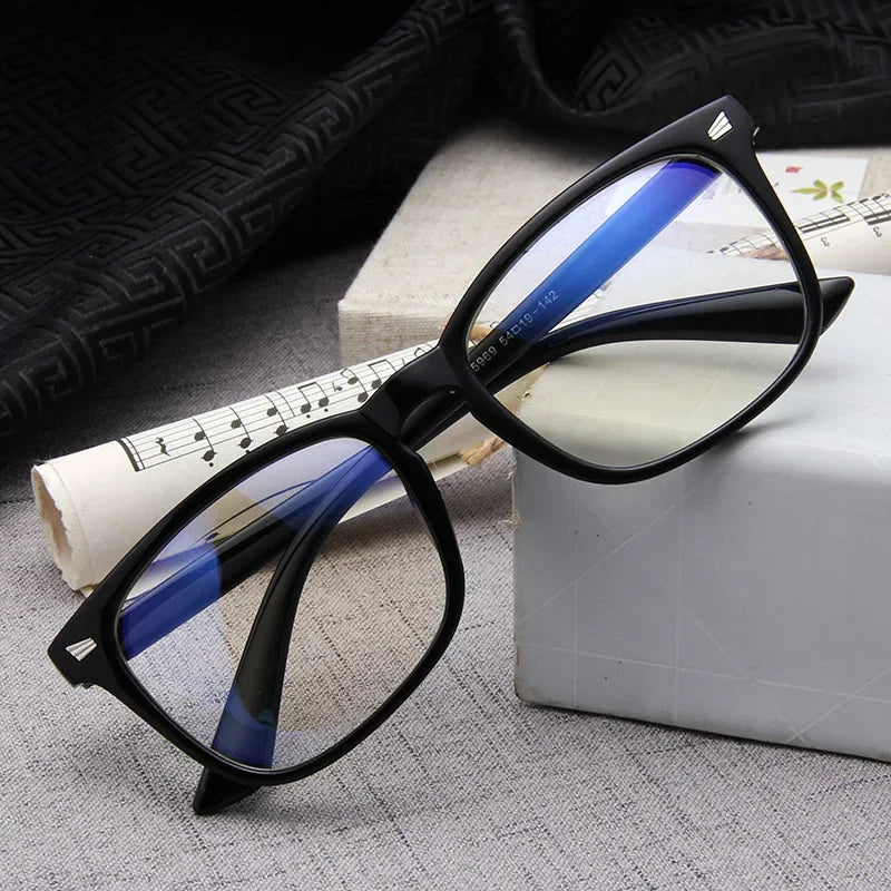 Premium Optics blue light glasses in color black on a textured surface